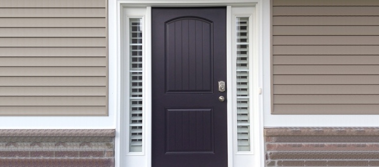 Entry Door Sidelight Shutters Next To Black Door In Fort Lauderdale, FL